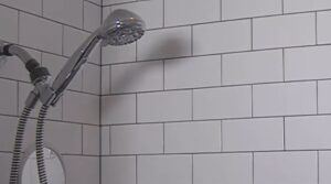 How does a low flow shower head work
