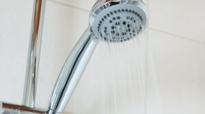 How to remove a shower head that is glued on