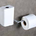 how to remove a toilet paper holder from wall